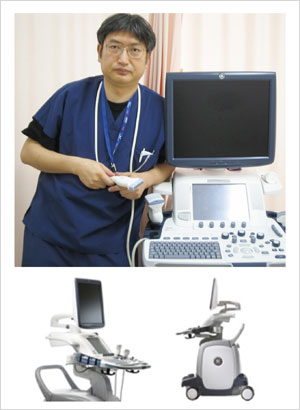 図6 新しい愛機 LOGIQ E 9 と筆者(水谷)