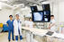 血管撮影室にて，清水科長（左から2人目）と放射線部スタッフ